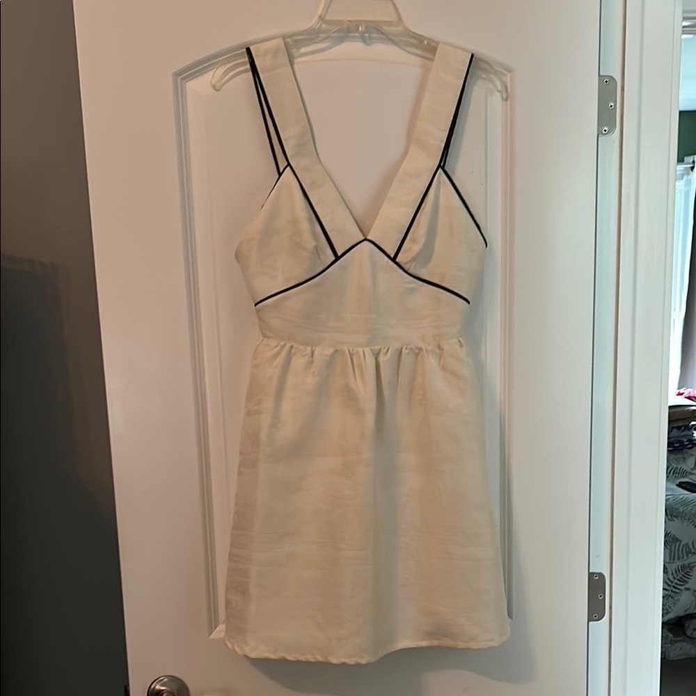 Elegant Cream Dress with Black Trim
